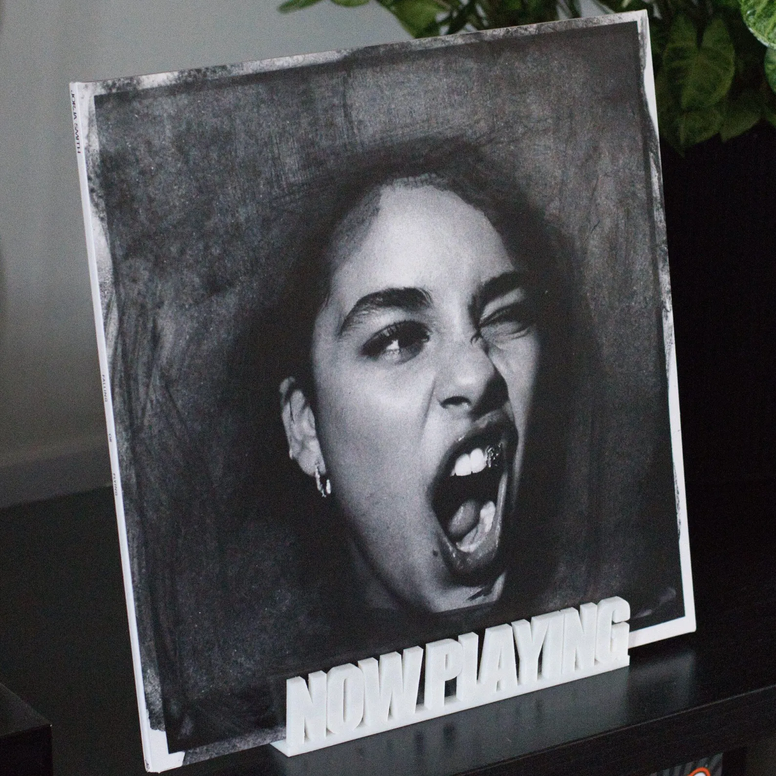 Rekkid Now Playing stand in white